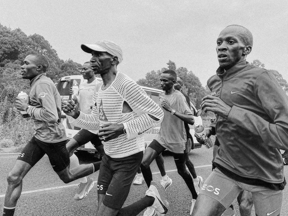 A pack of runners mid-stride in black and white, from ACG’s Radical AirFlow
