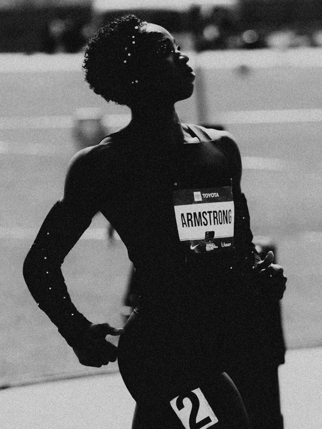Black and white: Armstrong looks up, one hand on her hip, rhinestones in her hair