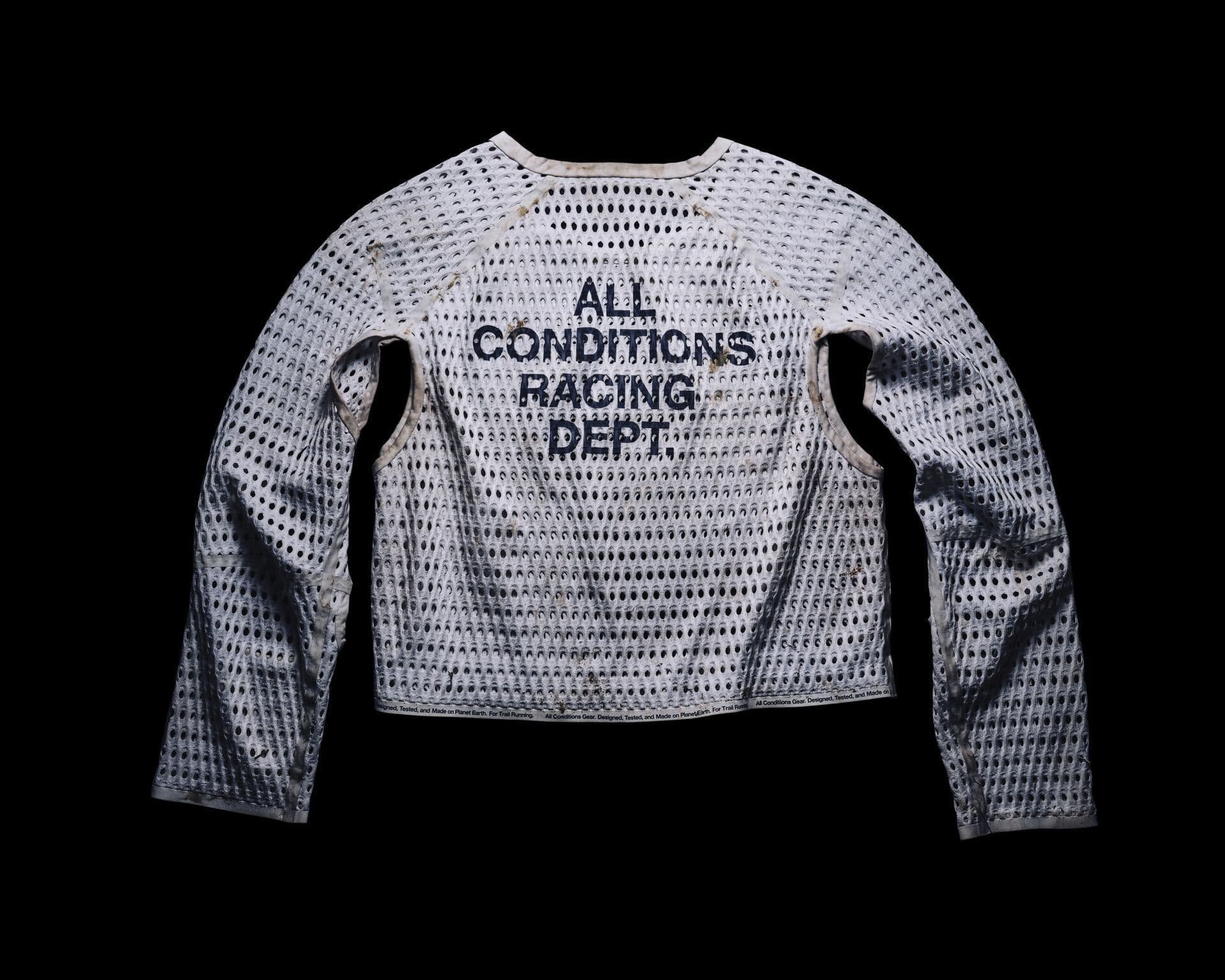 The back of the race-worn prototype on black, printed “All Conditions Racing Dept.”